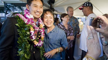 Republican Honolulu City Councilman Charles Djou, left, has his picture taken with Marian Crislip, left center, of Mililani, by Chita Stewart, far right, also of Mililani Saturday, May 22, 2009 in Honolulu.  