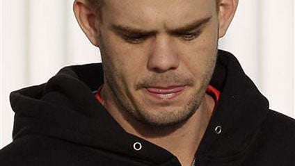 Joran Van der Sloot looks down before boarding an airplane to be flown back to the Peruvian border in Santiago, Chile, Friday, June 4, 2010. 