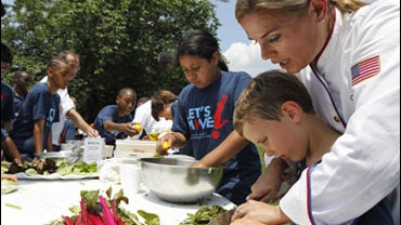 chef cat cora with elementary student at white house 