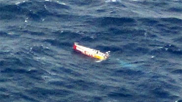 In this June 11, 2010 photo provided by The Fire and Emergency Services Authority of Western Australia (FESA) the sailing yacht Wild Eyes, with 16-year-old Californian girl, Abby Sunderland aboard floats disabled in the Indian Ocean after her sailboat bec 