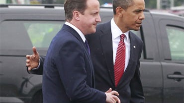 British Prime Minister David Cameron and U.S. President Barack Obama, center left and right respectively, talk before boarding Marine One helicopter in Gravehurst, Ontario, Canada, as they leave the G8 Summit en route to the G20 Summit in Toronto, Saturda 