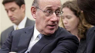 Kenneth Feinberg, the administrator of a program set up to compensate Gulf oil spill victims, talks with Camille Biros, on Capitol Hill in Washington, Wednesday, June 30, 2010, prior to testifying before the House Small Business Committee hearing titled " 