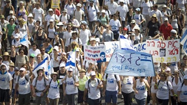 Israelis march in support of the release of captured Israeli soldier Gilad Schalit in Tel Aviv, Israel, Monday, July 5, 2010.  