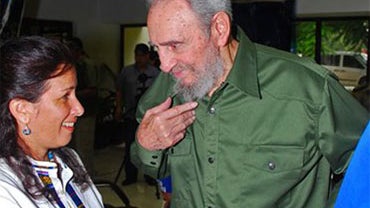 Fidel Castro, right, speaks to an unidentified person during a tribute to fallen fighters at a mausoleum in Artemisa, Cuba, Saturday July 24, 2010. Cuba honored its revolutionary fighters who died on July 26, 1953 when Castro led an attack on Moncada army 