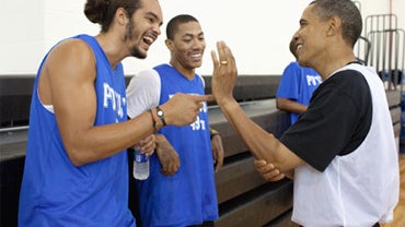 President Barack Obama jokes with Chicago Bulls players Joakim Noah and Derrick Rose 