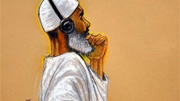 In this photo of a sketch by courtroom artist Janet Hamlin and reviewed by a U.S. Department of Defense official, 50-year-old al-Qaida cook from Sudan, Ibrahim Ahmed Mahmoud al-Qosi,, left, attends his war crimes trial at the Camp Justice compound on Guan 