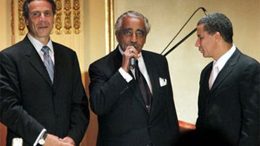 New York Attorney General Andrew Cuomo, left, joins Rep. Charles Rangel, center, D-N.Y., and New York Gov. David A. Paterson onstage during Rangel's birthday fundraiser, Wednesday, Aug. 11, 2010 at the Plaza Hotel in New York. Democratic Congressman Charl 