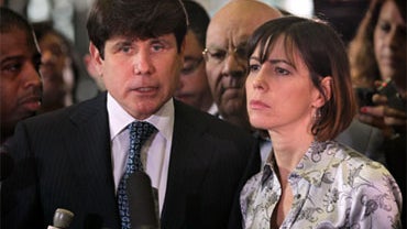 Former Illinois Governor Rod Blagojevich, with his wife Patti (R), speaks to the press following a verdict at his corruption trial August 17, 2010 in Chicago, Illinois. Blagojevich was found guilty on one charge of giving a false statement to federal agen 