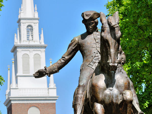 Paul Revere statue in Boston Freedom Trail, a national landmark and major tourist attraction. Old North Church steeple in the back. 
