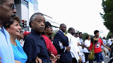 Rev. Al Sharpton, third from left, and others march through Washington, Saturday, Aug. 28, 2010, on the 47th anniversary of Martin Luther King Jr.'s "I Have a Dream" speech. (AP Photo/Susan Walsh) 