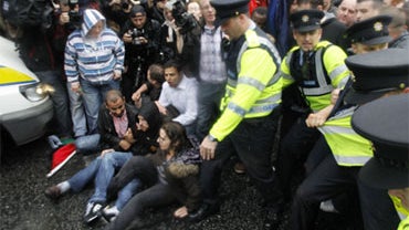 Irish police clash with protesters as they try to block the road as former British Prime Minister Tony Blair  arrived for a public book signing at the Eason book store, in Dublin, Saturday Sept. 4, 2010. 