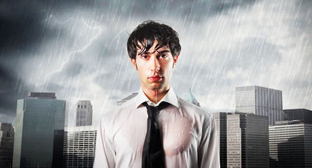 man standing in rain