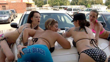 Photo of Bikini Clad Women Draped on a Police Cruiser Gets South Carolina Cop Fired 