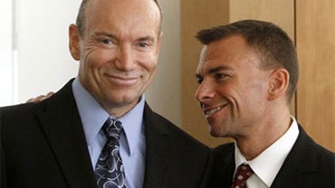 Martin Gill, left, father of two brothers, and attorney Robert Rosenwald smile during a news conference in Miami, Wednesday, Sept. 22, 2010. Florida's strict ban on adoption by gay people is unconstitutional because no other group, even people with crimin 