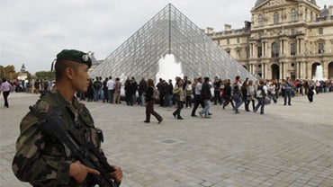French soldiers patrol around the Louvre museum in Paris, Sunday, Oct. 3, 2010. 