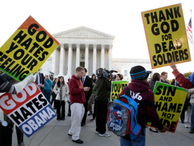 Members of the Westboro Baptist Church picket in front of the Supreme Court 