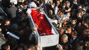 Iraqi mourners carry the body of slain Sheik Norzad Taher in a funeral procession on Dec. 2, 2005. Iraqi soldiers found the Kurdish cleric's body on Thursday, four days after he was kidnapped. 