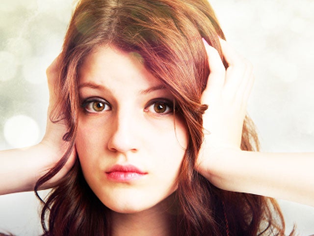 girl covering ears with hands 