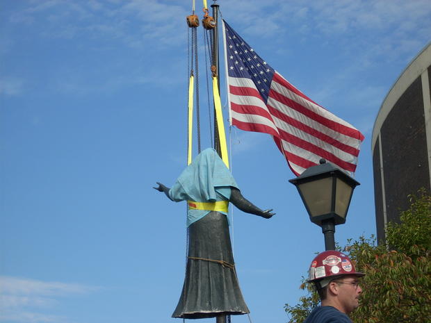 Statue of Kate Smith seems to sing 'God Bless America' as it is lifted away to storage 