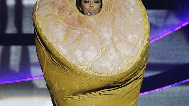 Host Eva Longoria Parker, wearing a costume depicting a ham, presents at the MTV European Music Awards 2010, in Madrid, Sunday, Nov. 7, 2010.AP Photo/Joel Ryan 