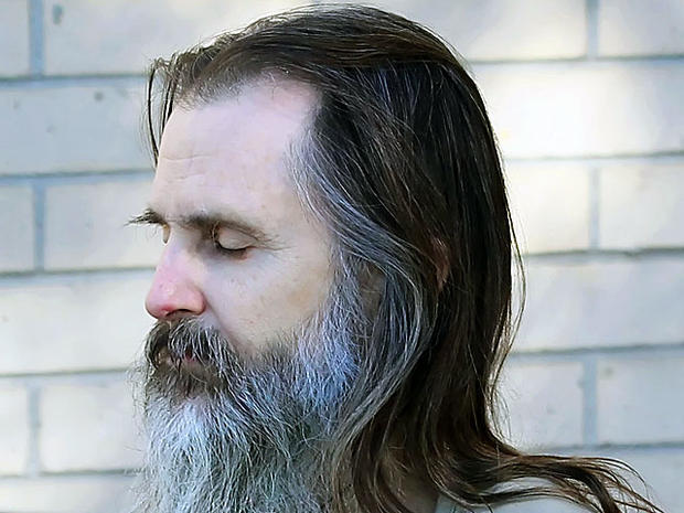 Brian David Mitchell (L), alleged kidnapper of Elizabeth Smart, is led out of Federal Court to a waiting car on November, 4 2010 in Salt Lake City, Utah. 