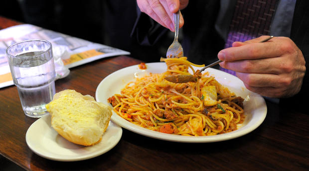 A diner twirls his spaghetti at Pellegri 