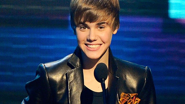 Justin Bieber accepts the award for pop/rock favorite male artist at the 38th Annual American Music Awards on Sunday, Nov. 21, 2010, in Los Angeles.  