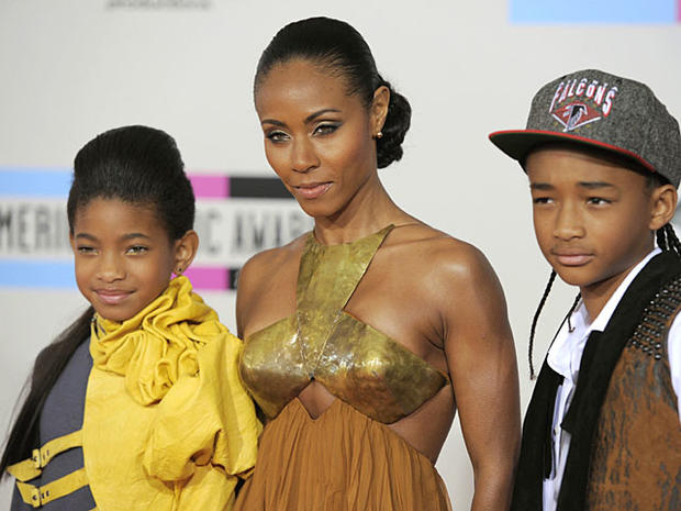 From left, Willow Smith, Jada Pinkett Smith, and Jaden Smith arrive at the 38th Annual American Music Awards on Sunday, Nov. 21, 2010 in Los Angeles. (AP Photo/Chris Pizzello) 