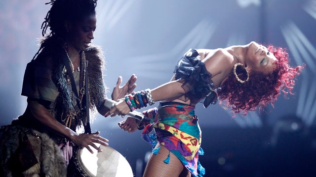 Rihanna, right, performs at the 38th Annual American Music Awards on Sunday, Nov. 21, 2010 in Los Angeles. (AP Photo/Matt Sayles 