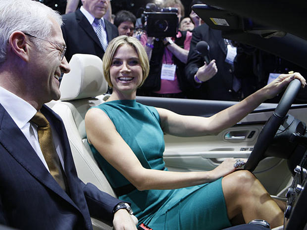 Jonathan Browning, President and CEO, Volkswagen Group of America, left, and German model Heidi Klum unveil the new Volkswagen EOS convertible at the Volkswagen exhibit at the Los Angeles Auto Show Wednesday, Nov. 17, 2010 in Los Angeles. (AP Photo/Damian 
