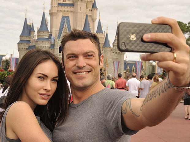 LAKE BUENA VISTA, FL - NOVEMBER 26: In this handout photo provided by Disney, actor Brian Austin Green (right) and his wife, actress/model Megan Fox (left), take a souvenir photo in the Magic Kingdom November 26, 2010 in Lake Buena Vista, Florida. Green ( 