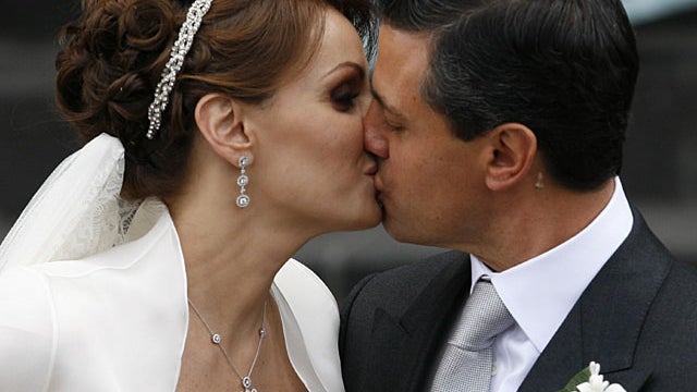 Mexican actress Angelica Rivera, right, kisses her new husband,  Pe 