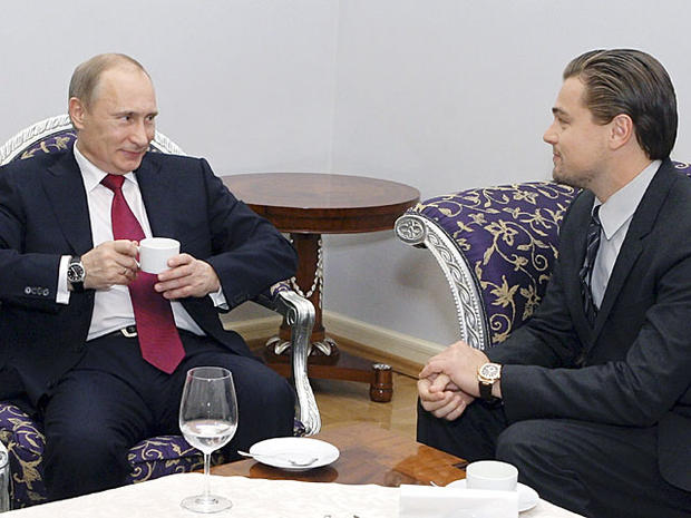 this Tuesday, Nov. 23, 2010 photo Russian Prime Minister Vladimir Putin speaks to U.S. actor Leonardo Di Caprio, right, after a concert dedicated to tiger conservation in St. Petersburg, Russia. Officials from the 13 countries where tigers live in the wil 