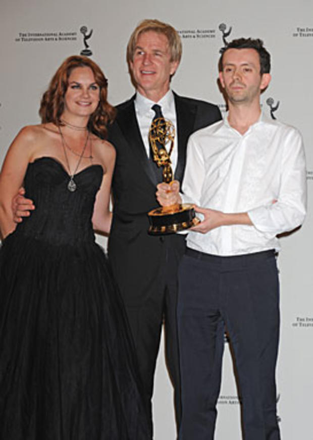 Ben Stephenson poses after receiving his award for the TV movie mini series "Small Island" with actress Ruth Wilson and actor Mathew Modine, center, at the 38th International Emmy Awards, Monday, Nov. 22, 2010, in New York. (AP Photo/Louis Lanzano) 
