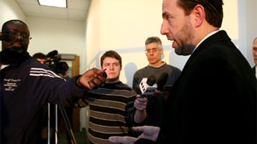 Republican U.S. Senate candidate Joe Miller, foreground, speaks to members of the media at the Rabinowitz Courthouse in Fairbanks, Alaska, on Monday afternoon, Nov. 29, 2010. 