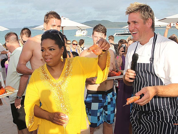 In this handout image provided by Harpo Productions Inc., Oprah Winfrey poses with Chef Curtis Stone on December 8, 2010 on Hamilton Island, Australia. Oprah Winfrey is in Australia with 302 audience members from the US, Canada and Jamaica and will tape e 