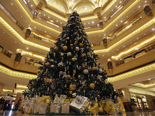 A Christmas tree which has been decked out with US$11 million U.S. (euro14.3 million) worth of gold and precious stones, stands at the lobby of the Emirates Palace hotel, in Abu Dhabi, United Arab Emirates, on Thursday Dec. 16, 2010. The hotel's general m 