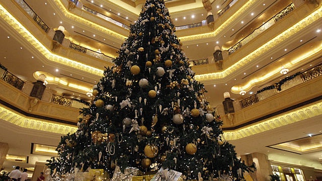 A Christmas tree which has been decked out with US$11 million U.S. (euro14.3 million) worth of gold and precious stones, stands at the lobby of the Emirates Palace hotel, in Abu Dhabi, United Arab Emirates, on Thursday Dec. 16, 2010. The hotel's general m 