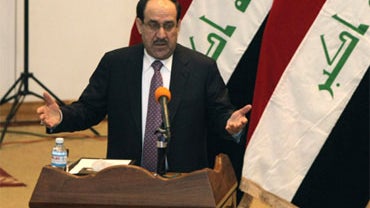 Iraq's Prime Minister Nouri al-Maliki speaks to Iraqi lawmakers during a parliament session in Baghdad, Iraq, Tuesday, Dec. 21, 2010. 