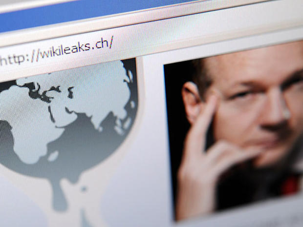 The homepage of Wikileaks.ch with a picture of its founder Julian Assange is seen on a computer screen on December 4, 2010 in Lausanne. WikiLeaks was battling to stay online after Sweden issued a new arrest warrant for its elusive boss Julian Assange, whi 