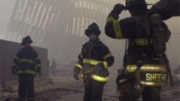 Firemen are deployed near the site of the World Trade Center in New York, in this Sept. 12, 2001 file photo. 