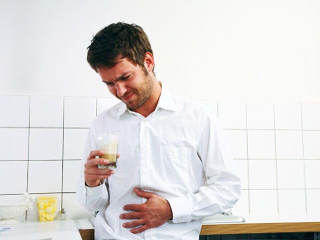 young man sick stomach 