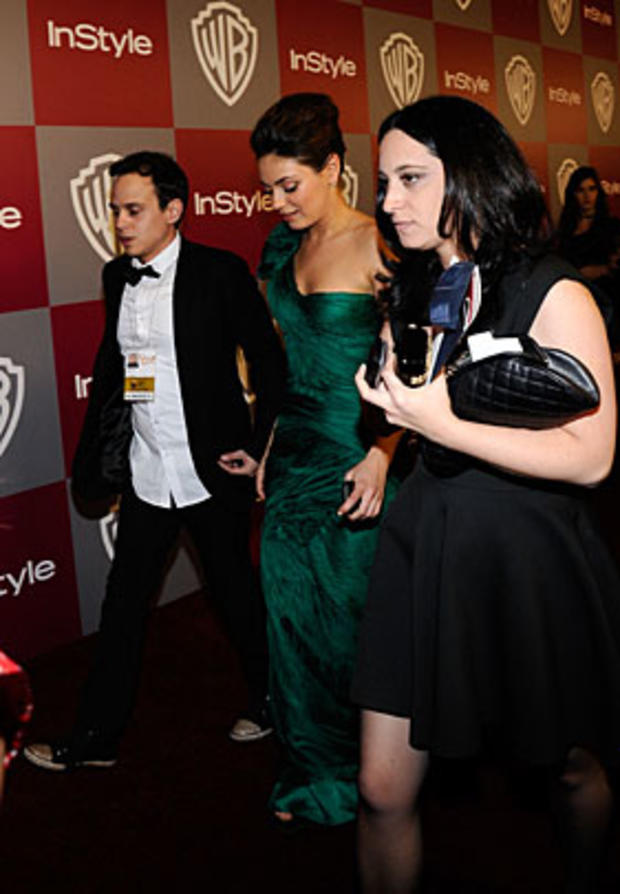 BEVERLY HILLS, CA - JANUARY 16: Actress Mila Kunis (C) arrives at the 2011 InStyle And Warner Bros. 68th Annual Golden Globe Awards post-party held at The Beverly Hilton hotel on January 16, 2011 in Beverly Hills, California. (Photo by Kevork Djansezian/G 