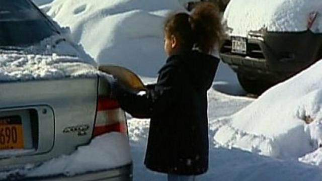 sarai-brushing-snow-off-car.jpg 