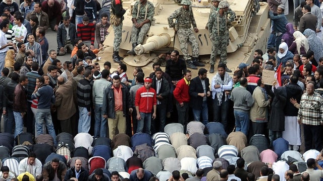 Protesters, Egyptian troops in Tahir Square. 