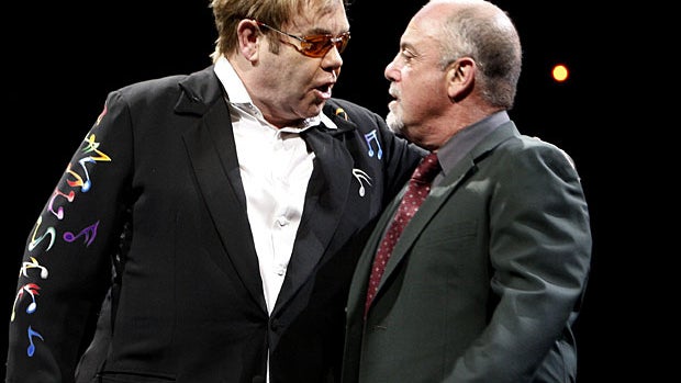 ANAHEIM, CA - MARCH 30: Musicians Sir Elton John (L) and Billy Joel perform onstage at the Honda Center on March 30, 2009 in Anaheim, California. (Photo by Kevin Winter/Getty Images)  