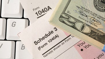 studio shot of tax form and keyboard 