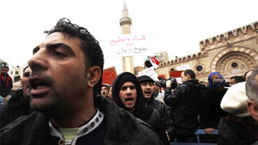 Demonstrators march through the streets from the Al Husseini Mosque to protest the appointment of new Prime Minister, Marouf Bakhit on February 4, 2011 in Amman, Jordan. 