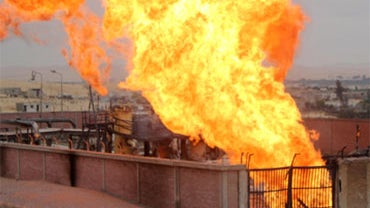Flames rise from a gas pipeline attack in the northern Sinai on February 5, 2011. Unknown saboteurs attacked an Egyptian pipeline supplying gas to Jordan, forcing authorities to switch off gas supply from a twin pipeline to Israel, an official told AFP. 