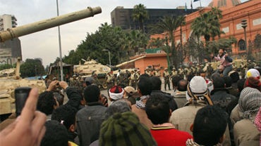 A protester leads fellow anti-government demonstrators in chants against Egyptian President Hosni Mubarak in Tahrir Square on February 5, 2011 in Cairo, Egypt.  